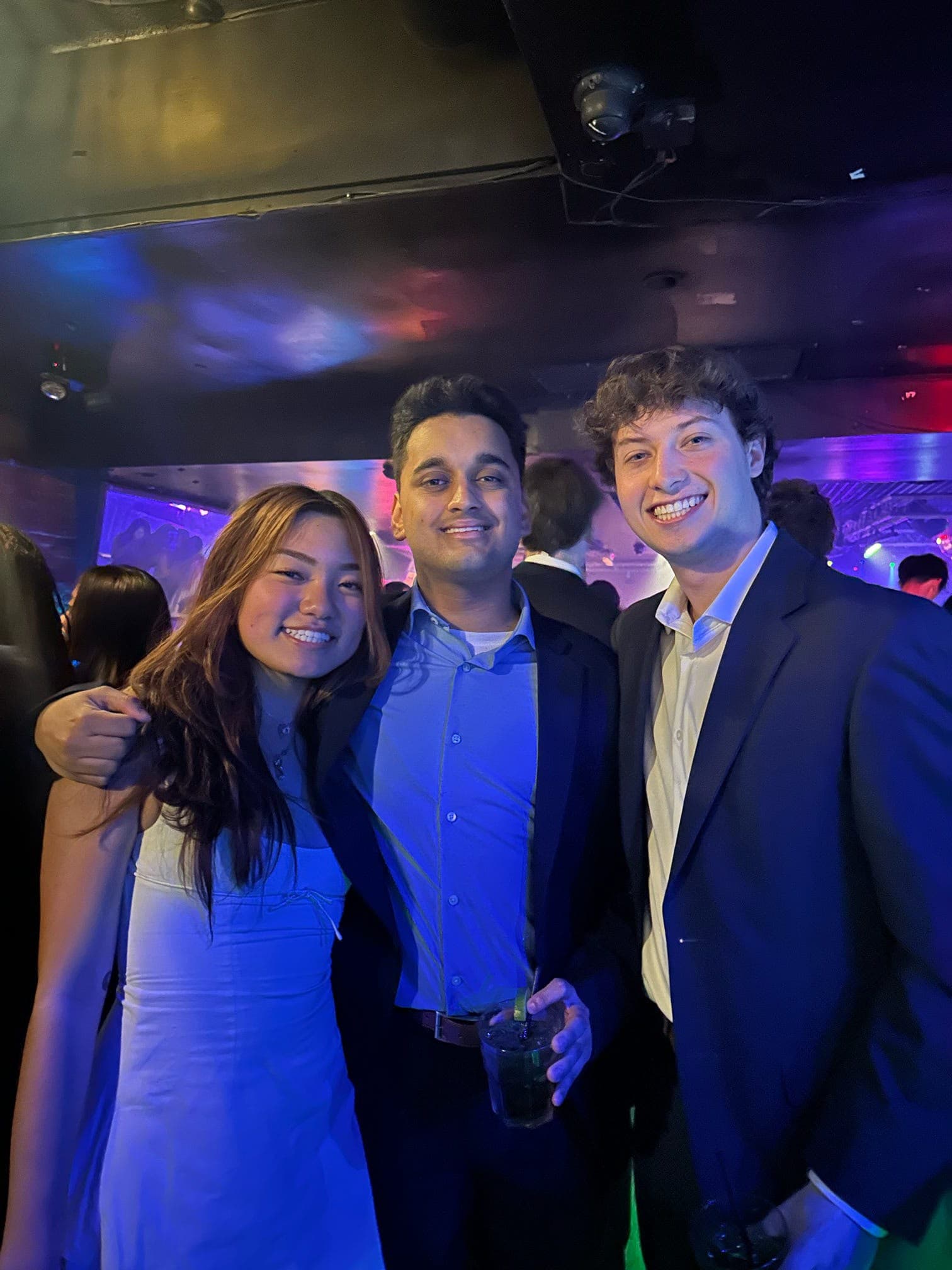 Three MECG members at a formal social event